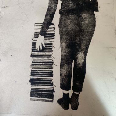 book pile print with hand